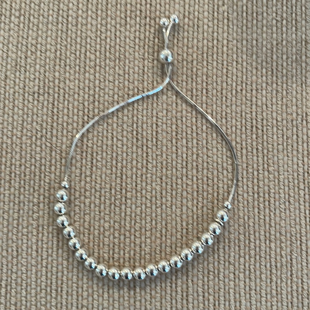 Sterling silver adjustable beaded bracelet.